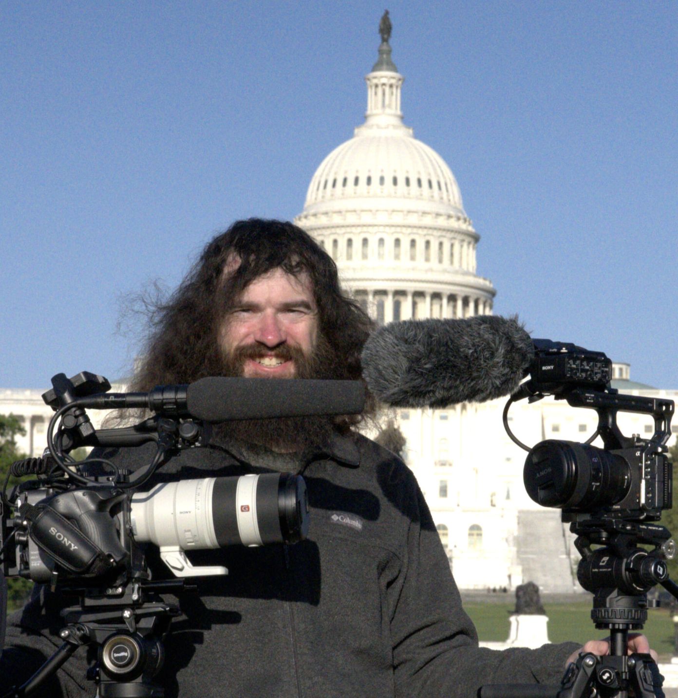 Brendan McDonough with two camera rigs on the National Mall, U.S. Capitol behind him